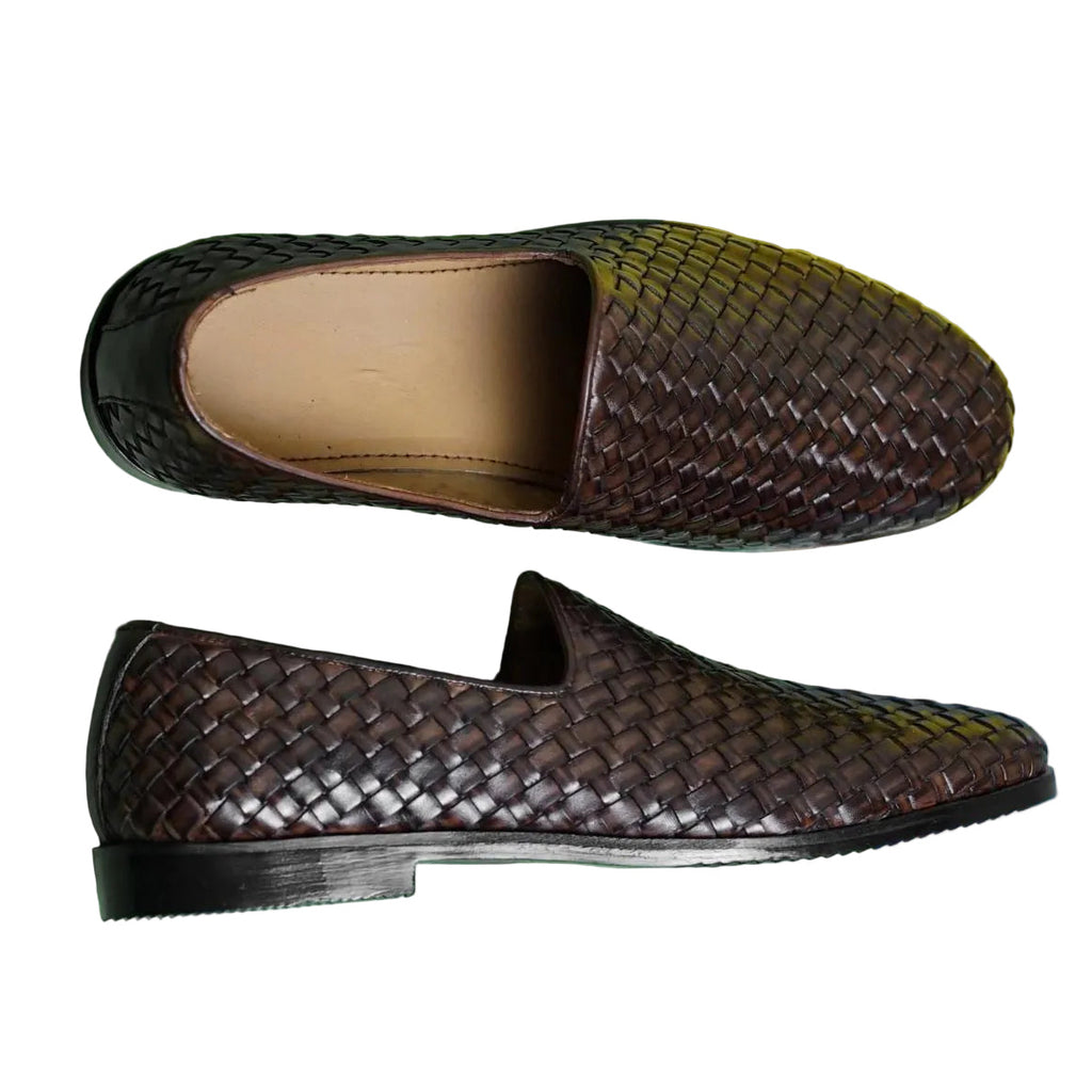 Men's handmade Venetian leather loafers with dark brown woven leather upper, cushioned interior, and black sole, stylish and elegant.