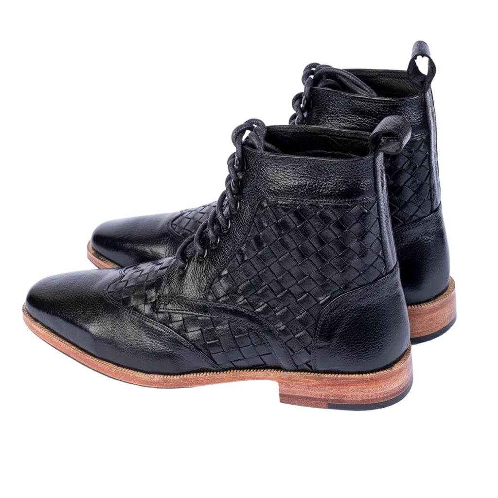 Pair of black woven leather men's ankle boots with textured and smooth leather panels, lace-up front, and wooden heel