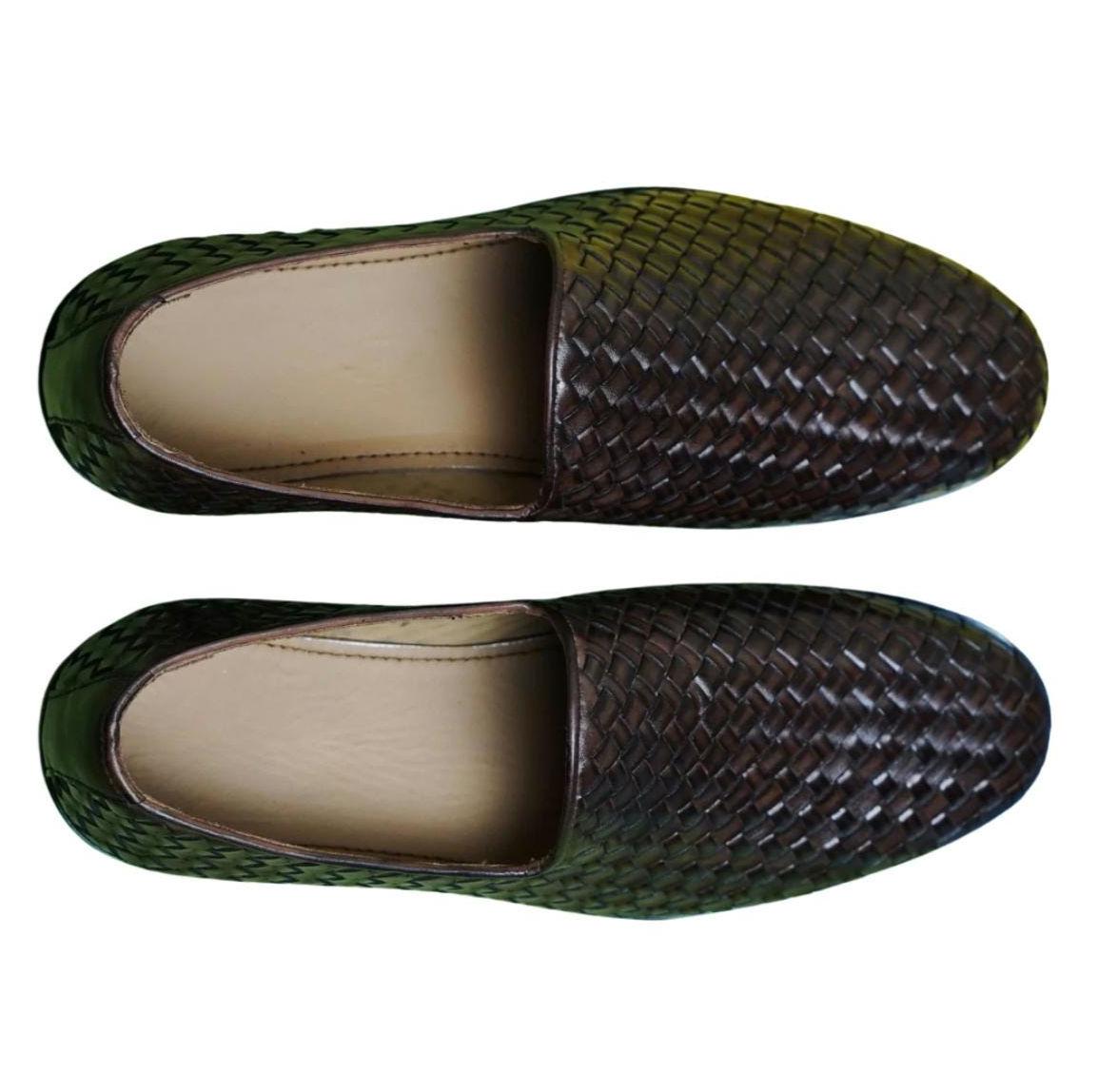 Top view of men's handmade Venetian leather loafers with dark brown woven pattern, beige interior, and slip-on design for formal wear.